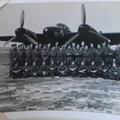 Thirty five airmen in front of a Mosquito 